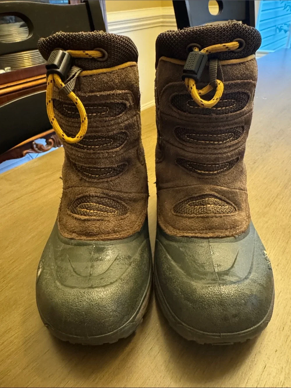The North Face Kids Brown Snow Boots with Yellow Pull Cords